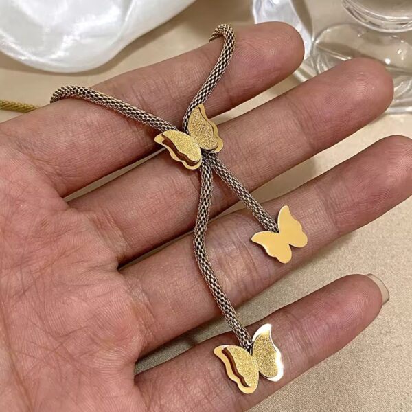 golden butterfly pendant necklace – triple charm adjustable chain | noorah.life